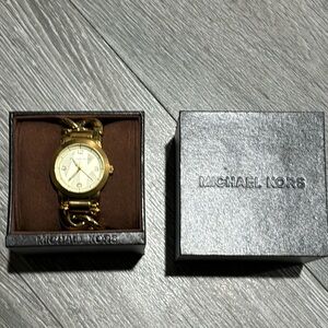 Michael Kors chain link gold-tone stainless steel watch.